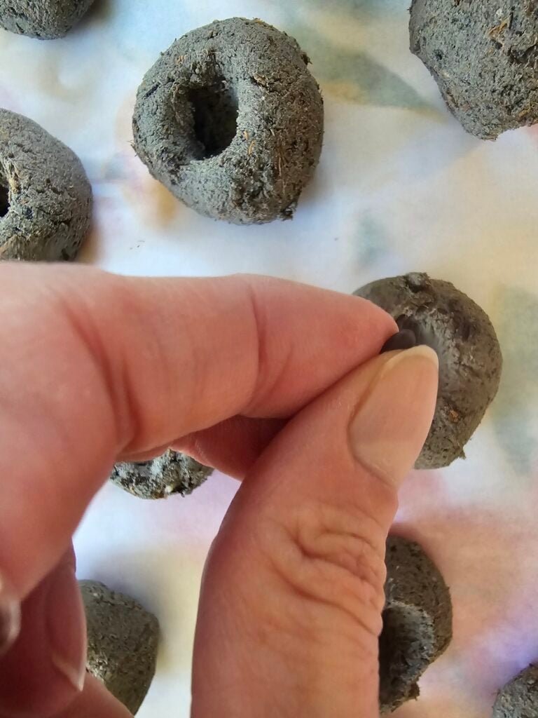 The Outdoor Apothecary adding seeds to the DIY seed bombs